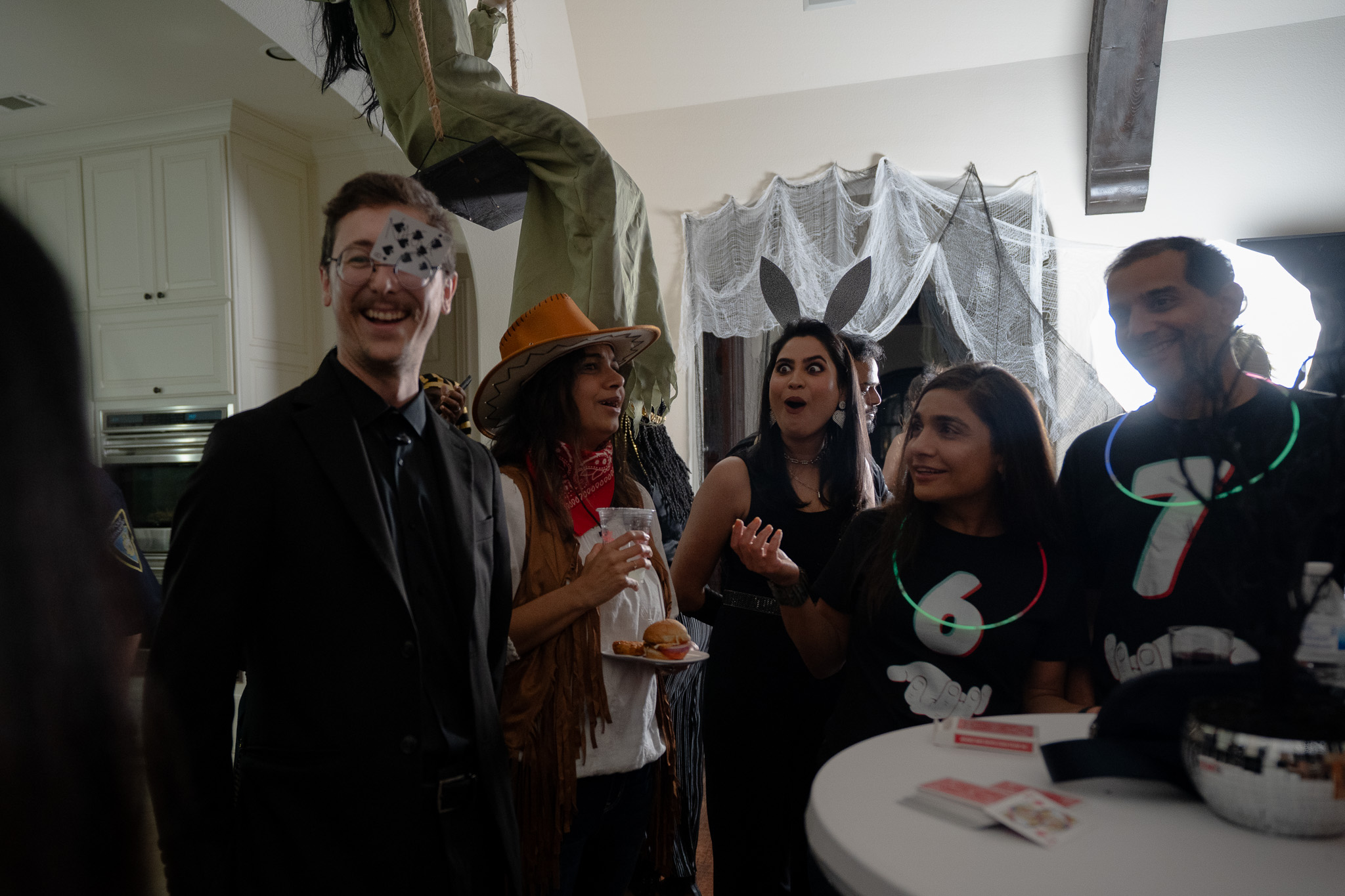 Guests reacting to close-up magic at a Houston private party